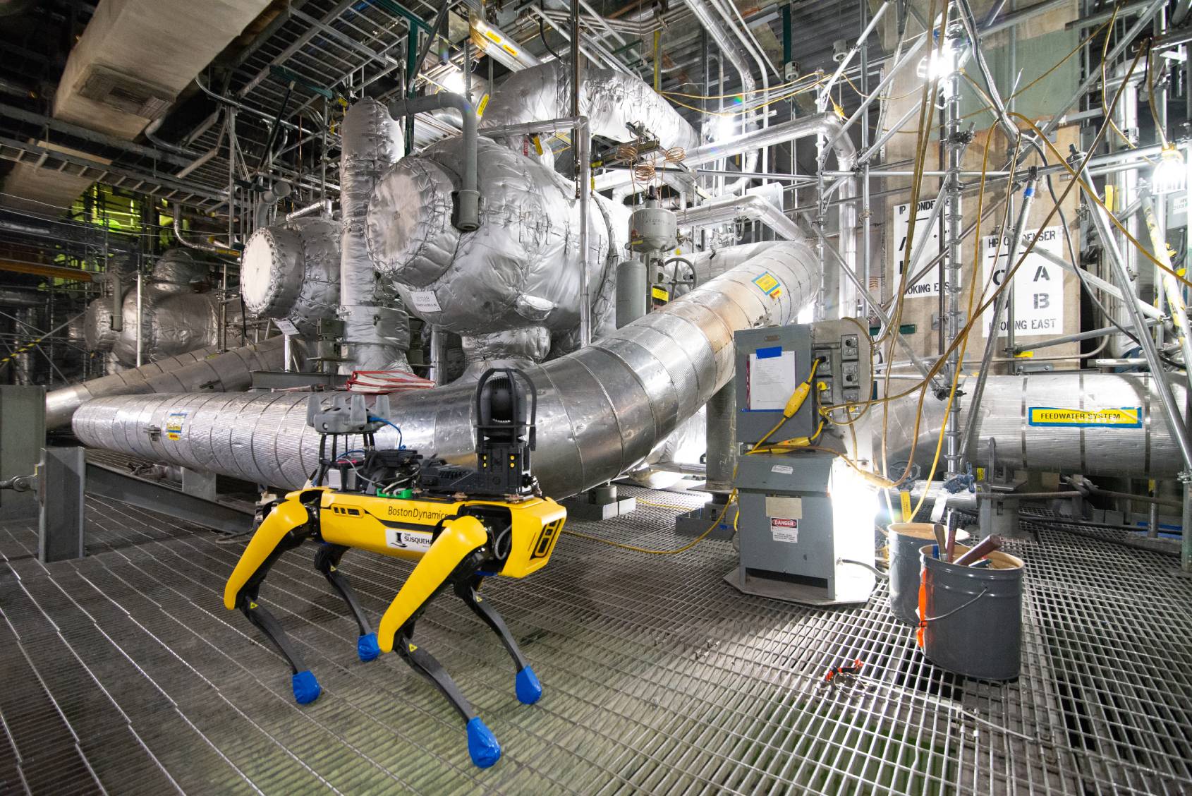 Spot equipped with multiple payloads performing work in a nuclear power plant